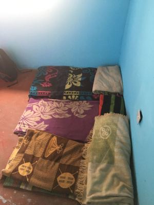 This is where the 3 smallest children sleep at the moment. On a blanket, in the corner, next to a loose electrical socket. We'll be changing all of that with your donations as soon as we can.